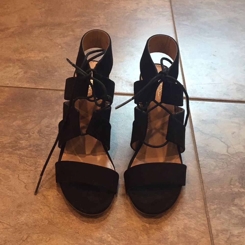 Strapped black sandals.